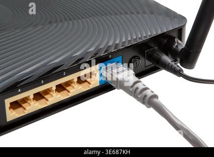 Network  Ethernet wireless Router Hub. Ethernet computer network cable wire end jack plug plugged  LAN port hub outlet Stock Photo
