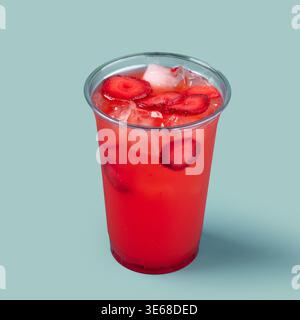 Strawberry lemonade drink with ice in plastic cup Stock Photo
