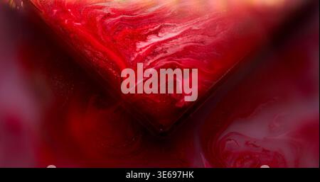 Paint spilling. Glass cube angle. Blur red pink purple color geometric texture vibrant droplets on abstract vibrant art background. Stock Photo