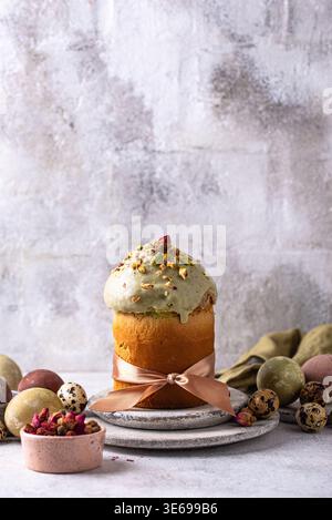 Traditional Easter cake kulich with pistachio Stock Photo