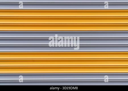 Yellow and Gray Metal Roller Shutter Door Abstract Industrial Background. High quality photo Stock Photo