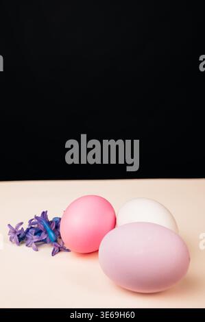 Stylish Modern Composition Featuring Easter Eggs And Hyacinth Blossoms Against Dark Backdrop Stock Photo