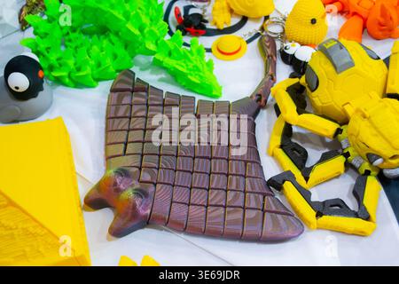 3D printed many different art objects. Objects printed on 3D printer from melted colored plastic. Models created on 3D printer from threads of molten plastic. Modern additive progressive technologies Stock Photo