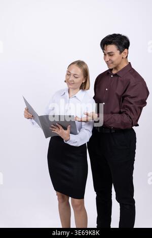 Two office colleagues discussing project with digital tablet Stock Photo