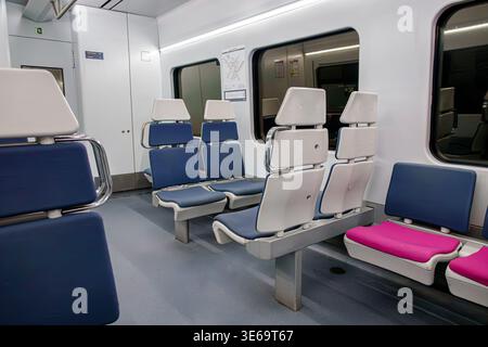 Madrid Spain,Linea Cercanas Madrid C-1 line,train interior empty seats,modern commuter carriage design,blue white seating arrangement,clean public tra Stock Photo