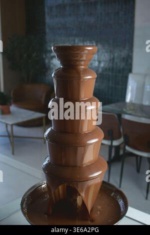 A view of a multi-tiered chocolate fountain. Stock Photo