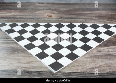 A view of a folded checker paper liner, as a background. Stock Photo
