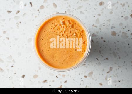 A top down view of carrot juice. Stock Photo