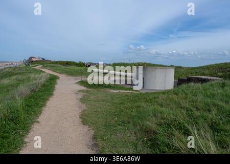 Sandy path through dunes leading to a WWII coastal gun position at Atlantikwall Raversyde on the Belgian coast. Stock Photo