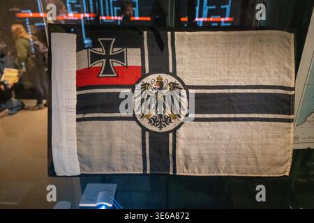Oostende, Belgium - 14 Apr 24: Close-up of a historic German military flag with iron cross and eagle emblem on display at Atlantikwall Raversyde, Belg Stock Photo