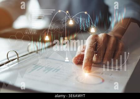 Close up Businessman hand pointing at financial paperwork with financial network diagram. Fintech, cryptocurrency, DeFi, Stake, Block chain, digital a Stock Photo