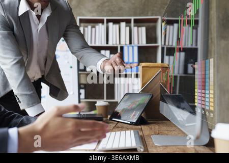 Group of Business man and Accountant checking data document on digital tablet for investigation of corruption account. Anti Bribery concept Stock Photo