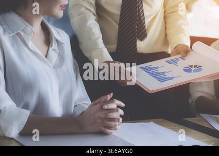 Group of Businessman and Accountant checking data document on digital tablet for investigation of corruption account . Anti Bribery concept Stock Photo
