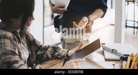 Engineer or architect doing model 3D the project on tablet with partner in offlice. Construction concept Stock Photo