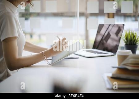 User experience concept. Creative Web Designer sketching application and developing template layout on laptop, framework for digital devices Stock Photo