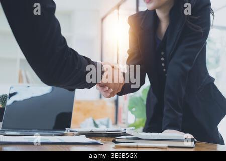 Business people shaking hands to celebration partnership and business deal, Team Working together for next year concept Stock Photo