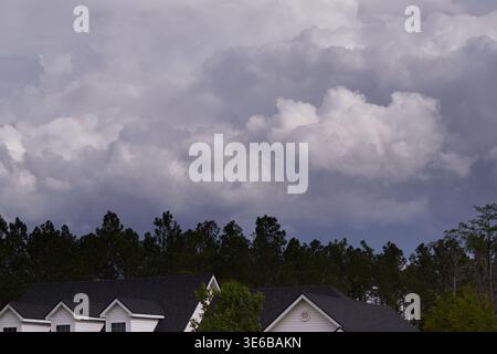 Black & White Photography. Dark and moody storm clouds, hanging over a farm house in rural America! Stock Photo