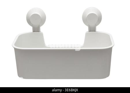 White plastic shower caddy with suction cup mount. Bathroom wall organizer for soap and shampoo bottle storage. Home bath accessory for modern interio Stock Photo