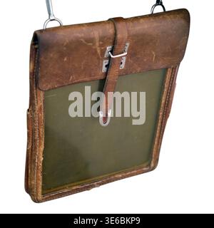 Vintage brown leather map case isolated on white background. Old military document holder with shoulder strap. Retro accessory for outdoor exploration Stock Photo