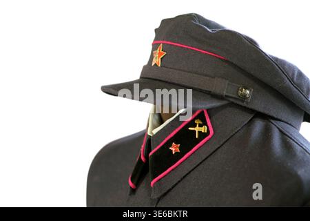 Railway worker uniform with peak cap and badge for train conductor. Vintage transport staff clothing isolated on white background. Historical professi Stock Photo