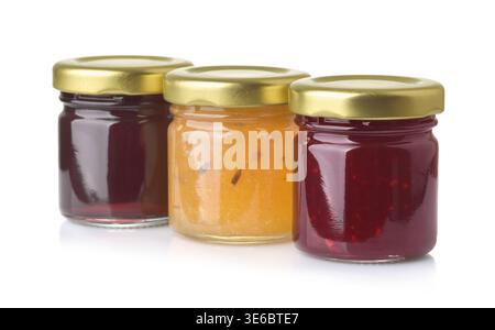 Row of three various jam jars isolated on white Stock Photo