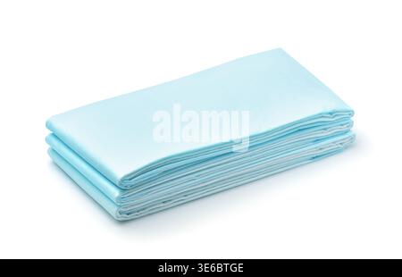 Stack of blue disposable non woven bed sheets isolated on white Stock Photo