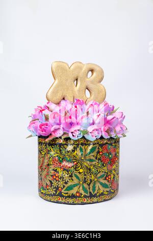 Easter Kulich in Decorative Box with Flowers and Golden XB Topper Stock Photo