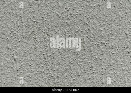 Rough stucco wall texture with grainy surface Stock Photo