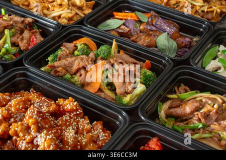 A view of several Chinese fast food entrees, as a background. Stock Photo