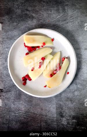 Chopped pear on a plate seen from above Stock Photo