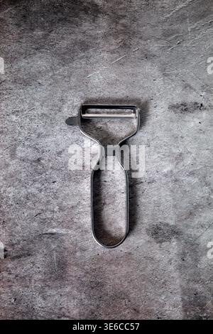 Manual potato peeler seen from above Stock Photo