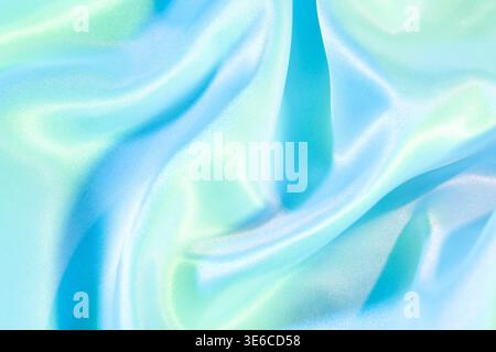 Smooth shiny satin fabric with flowing waves and soft light reflections Stock Photo
