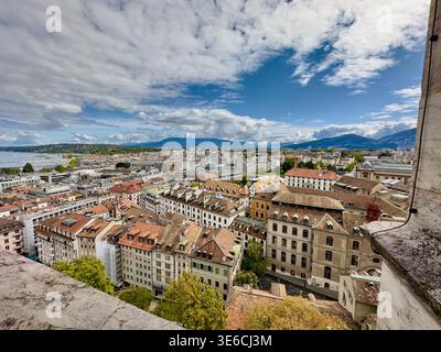 A view over the rooftops of Geneva, with Lake Geneva and the Alps in the background, SwitzerlandA view over the rooftops of Geneva, with Lake Geneva a Stock Photo