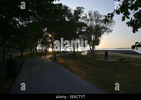 East Coast Park, Singapore's largest park, with dedicated jogging and cycling paths along the beach and scenic views of the Singapore Strait Stock Photo