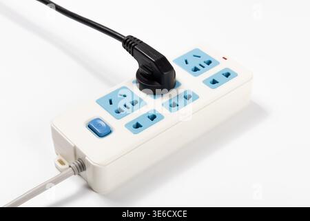 Power strip with multiple outlets and a plug connecting to supply electricity Stock Photo