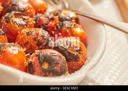 A plate of roasted cherry tomatoes as served in Lisbon, Portugal. Stock Photo