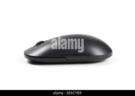 Black wireless optical mouse showing its ergonomic design and matte finish Stock Photo