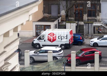 Krakow, Poland - December 1, 2025: A prominent DPD delivery van, white, parked on an urban street, highlighting modern logistics and swift parcel serv Stock Photo