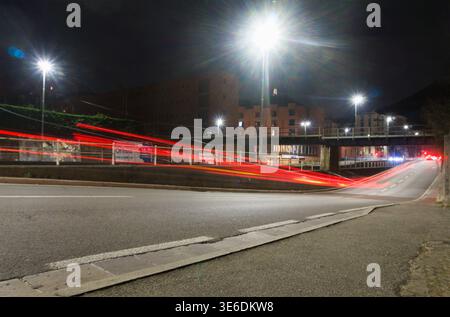 Light trails of a car in the night, Italy Stock Photo