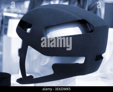 Protective helmet. Helmet printed on 3D printer from powder material. Model printed on 3D printer from melted polyamide powder. Multi Jet Fusion. Modern additive progressive 3D printing technology Stock Photo