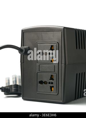 black ups unit with two universal power outlets and power cord isolated white background, rear view of uninterrupted power supply Stock Photo