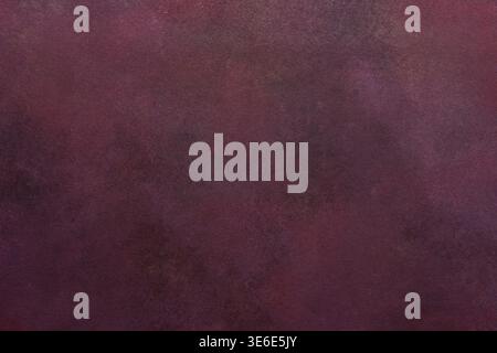 A dark maroon surface exhibits a subtle texture. Light and dark variations create a smooth, blended effect over the entire area. Stock Photo