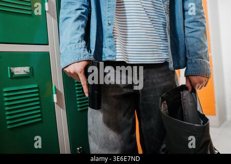 Agression and shooting in the high school. School gun violence concept. Stock Photo
