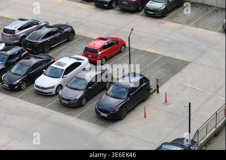 April 2, 2026, Tbilisi, Georgia High-resolution photo of a secured parking lot with concrete surface and marked parking spaces. The area is equipped w Stock Photo