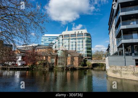 Old and new historic and contemporary office and residential buildings on the side of the river Kennet in Reading town centre, Reading, Berkshire, UK Stock Photo