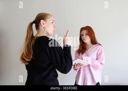 Female students studying together, discussion and learning process concept. Stock Photo