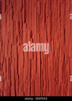 High resolution red textured wall background with rough vertical structure. Abstract surface suitable for design, backgrounds and creative projects. Stock Photo