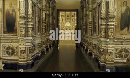 Beautiful Golden interior of Church with bright icons. Stock footage. Beautiful iconostasis in middle of Golden hall of Church. Luxury gold interior o Stock Photo