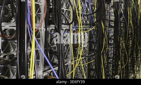 Fiber optic equipment in a data center, IT and modern technologies concept. Server room routers and fiber optical cables Stock Photo