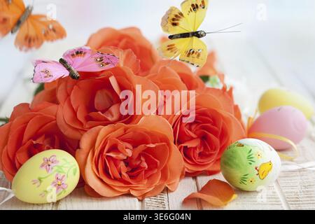 Bouquet of roses, easter eggs and butterfly Stock Photo